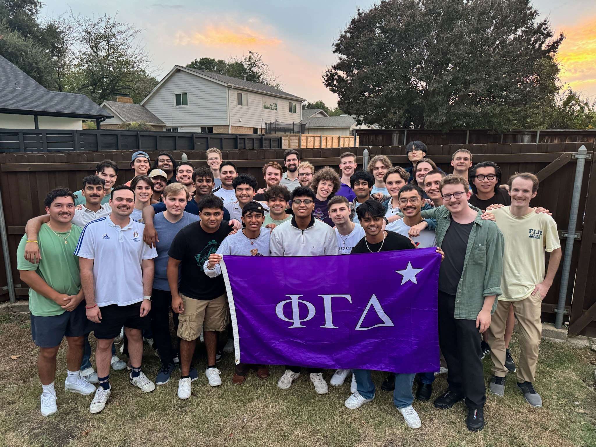 Group photo of graduate and undergraduate brothers